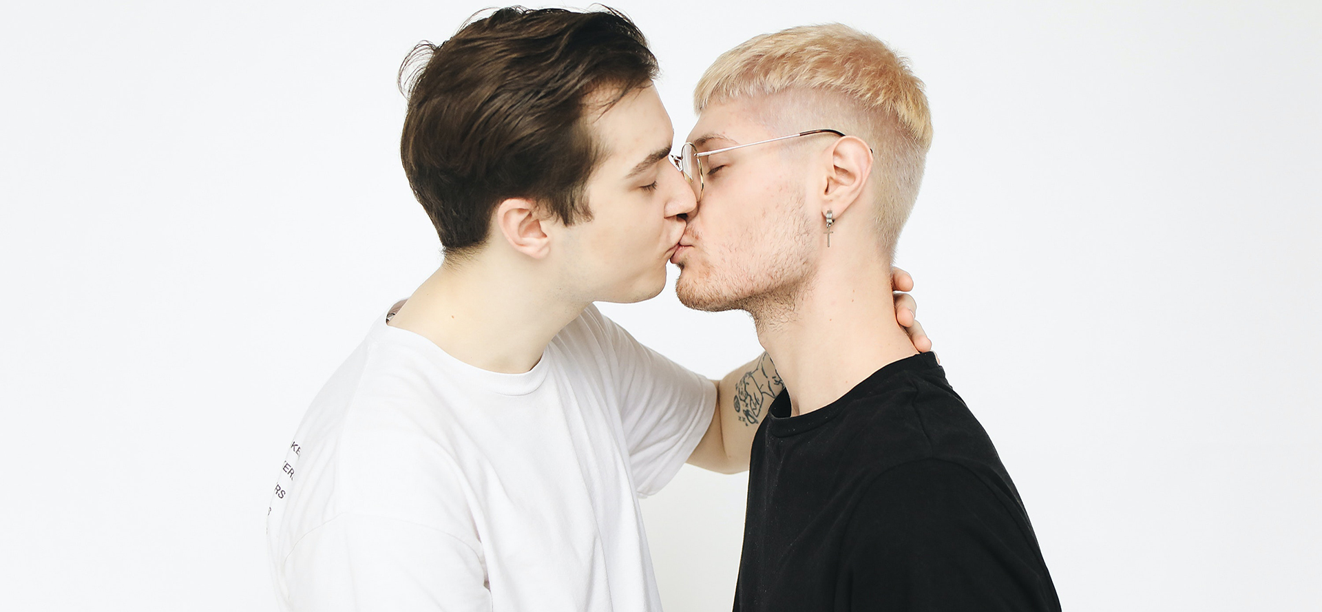 Gay couple kissing.