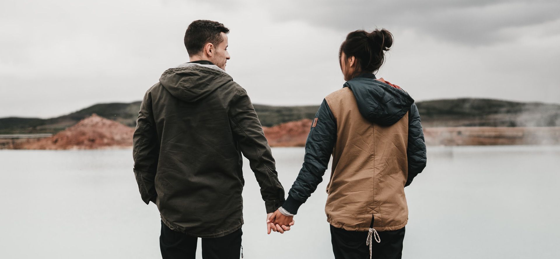 Pagan couple holding hands.