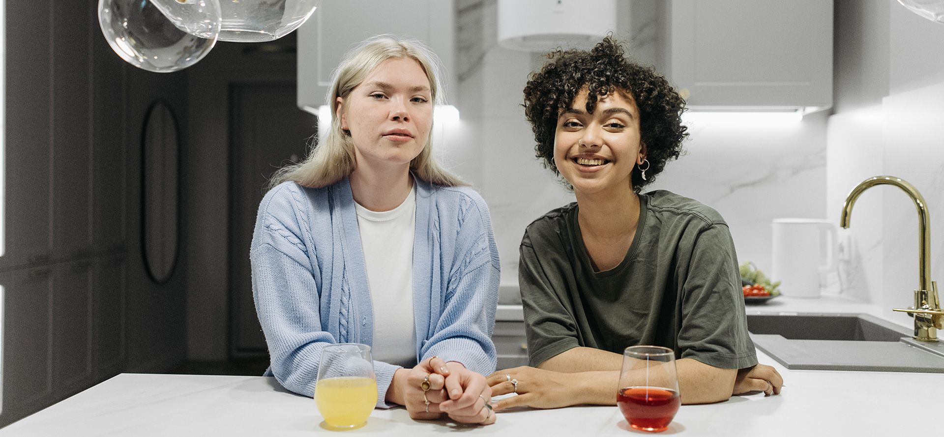 Queer couple in the kitchen.