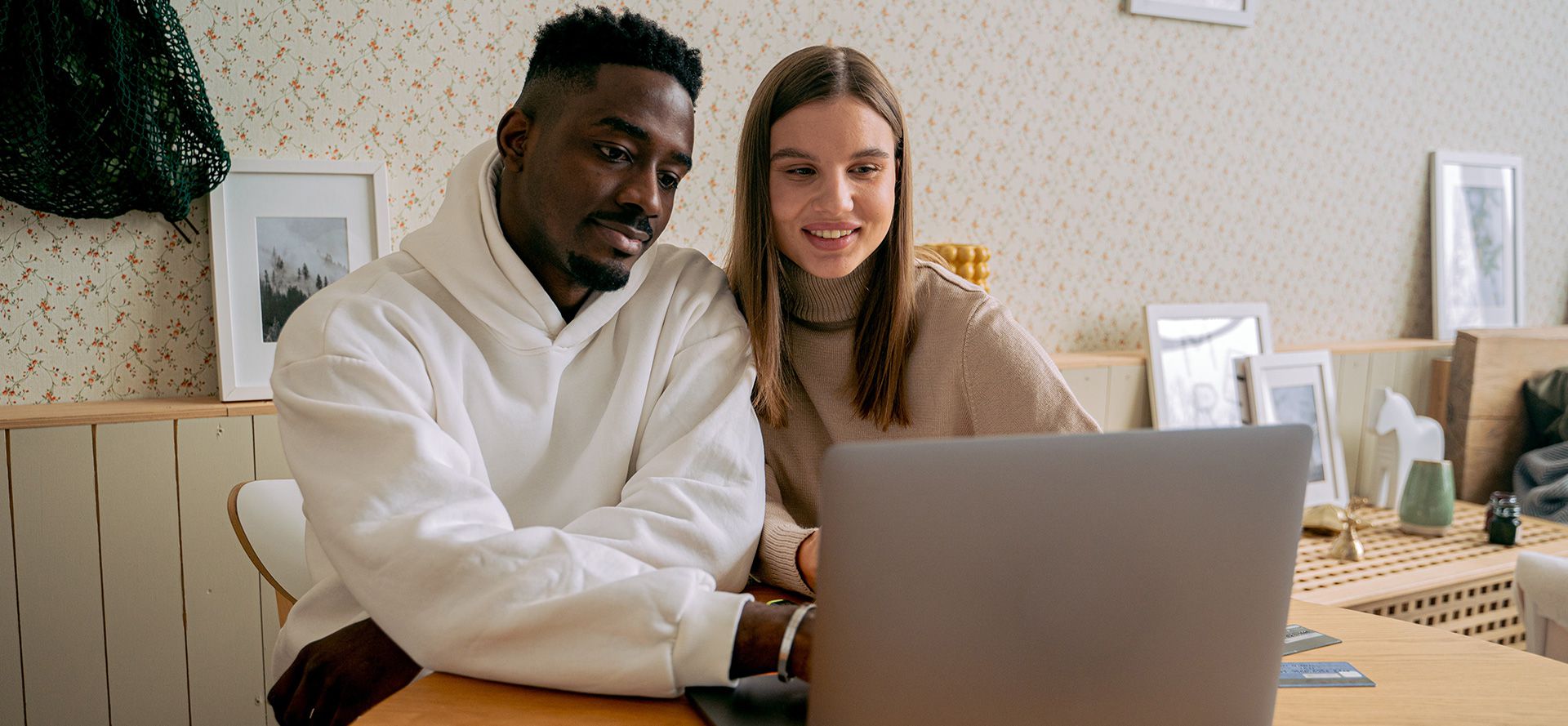 White woman black man with notebook.