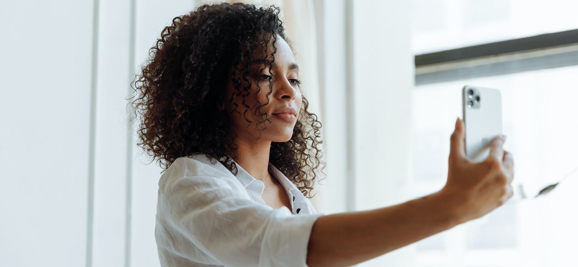 A Woman Taking Photo For Dating Profile