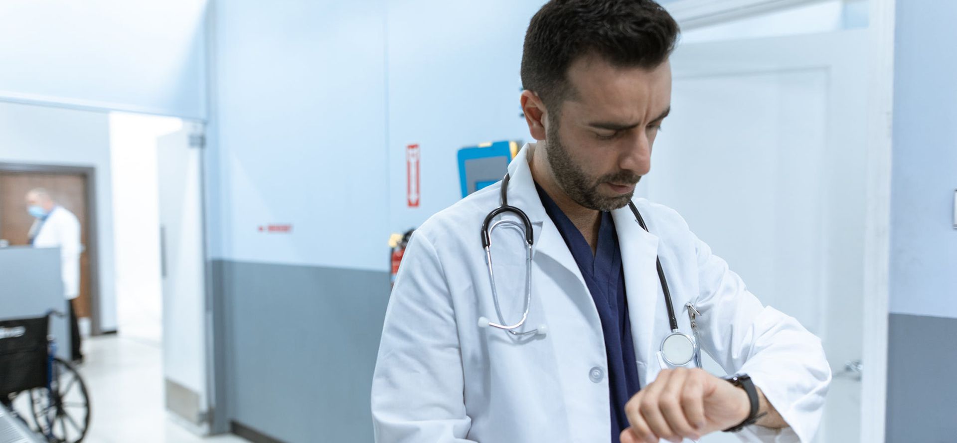 The busy doctor looks at his watch.