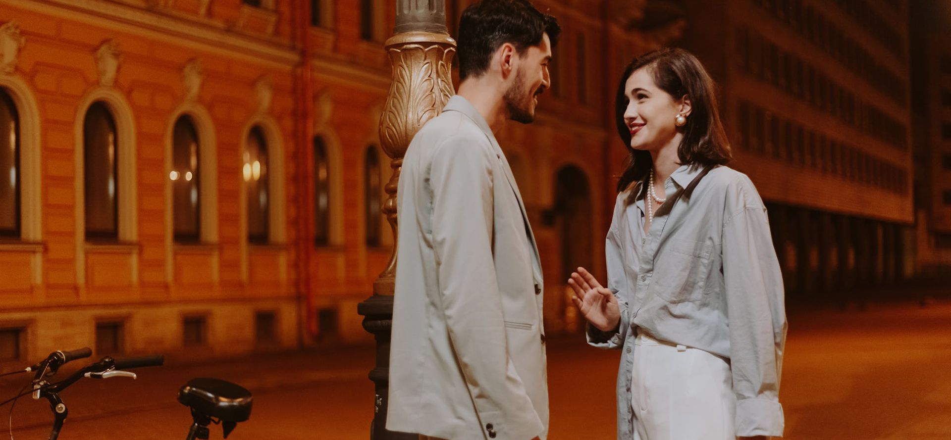 A Christian couple strolls through town on a date.