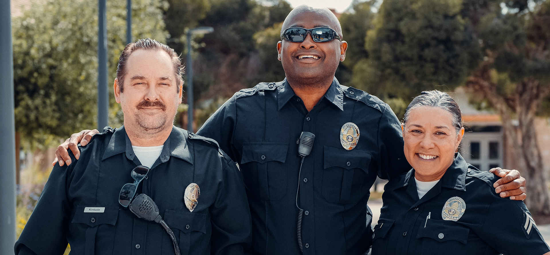 Three cops patrolling the street.