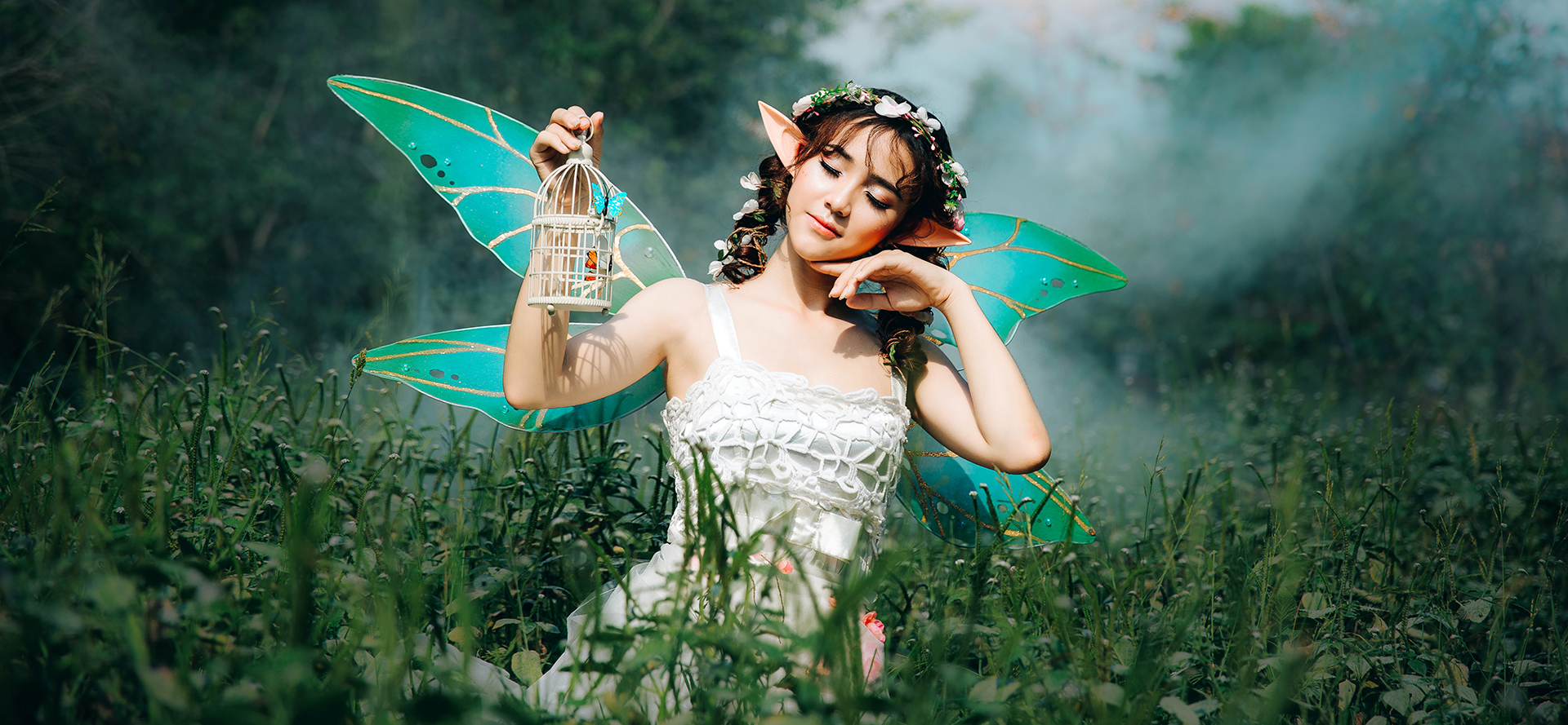 The girl cosplays a forest fairy.