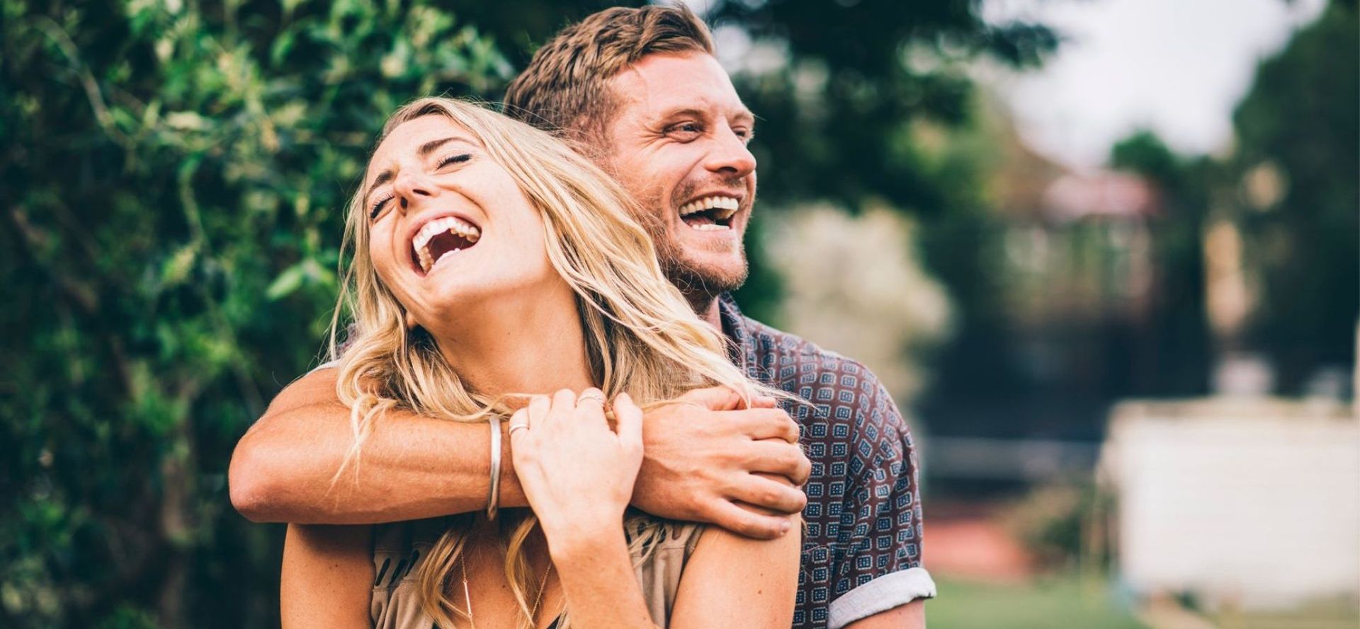 Couple laughing together.