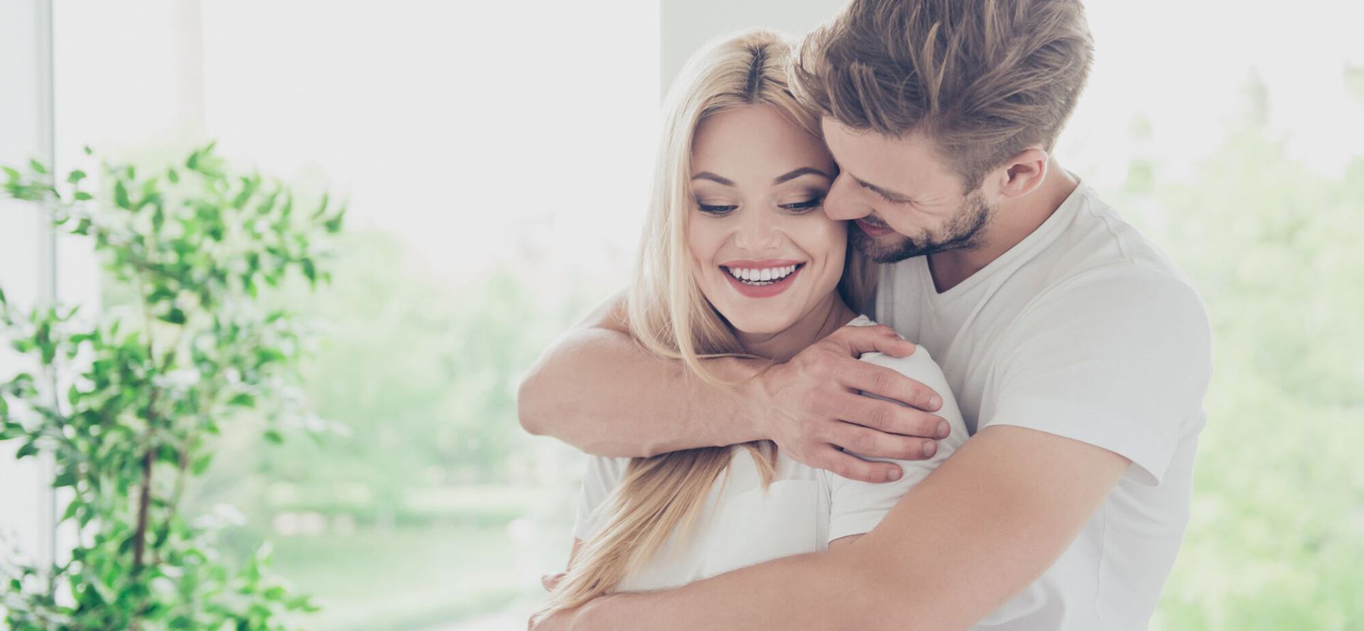 A man hugging a woman.