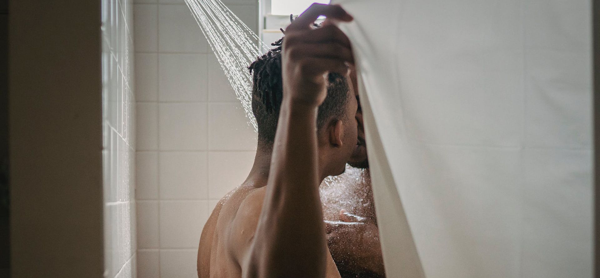 Couple having sex in a shower.