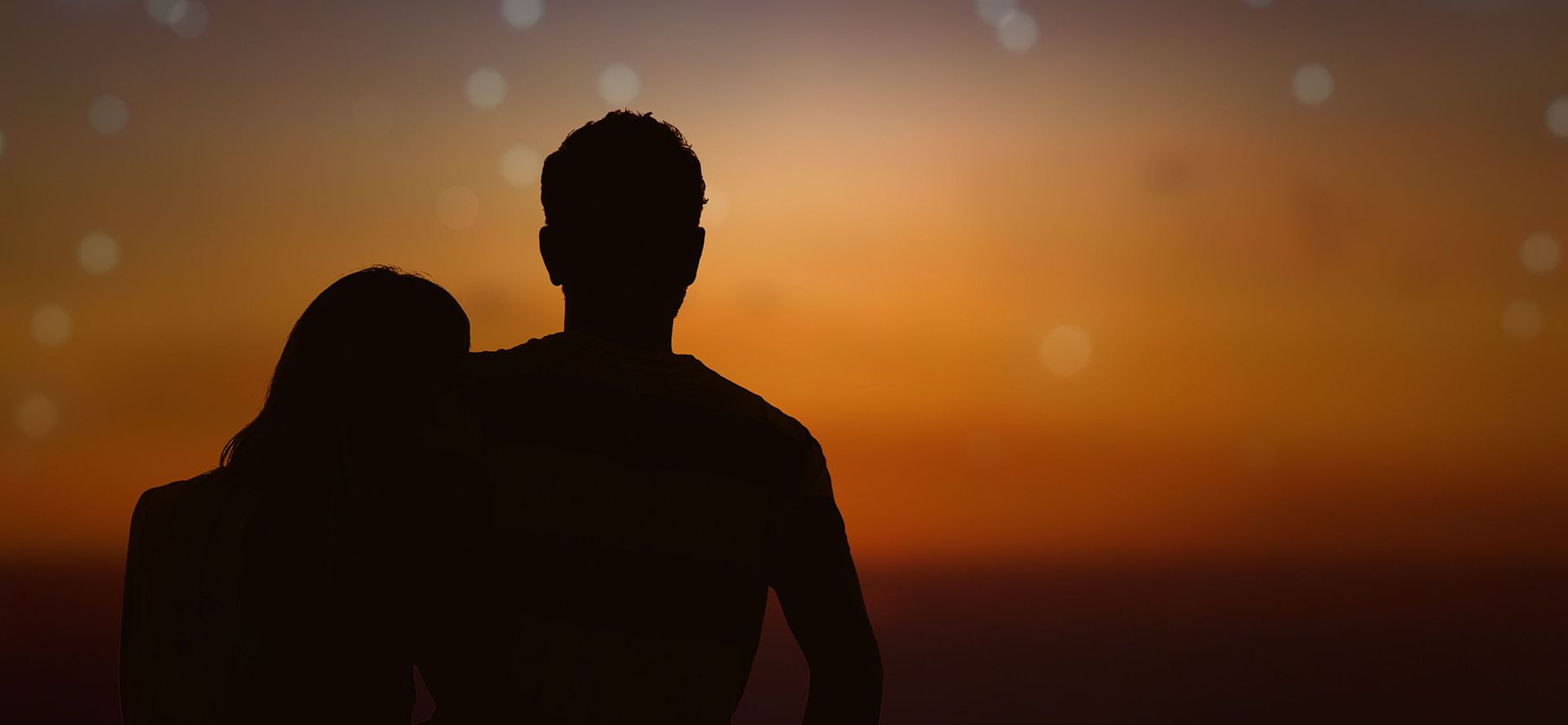 Couple looking at the constellations.