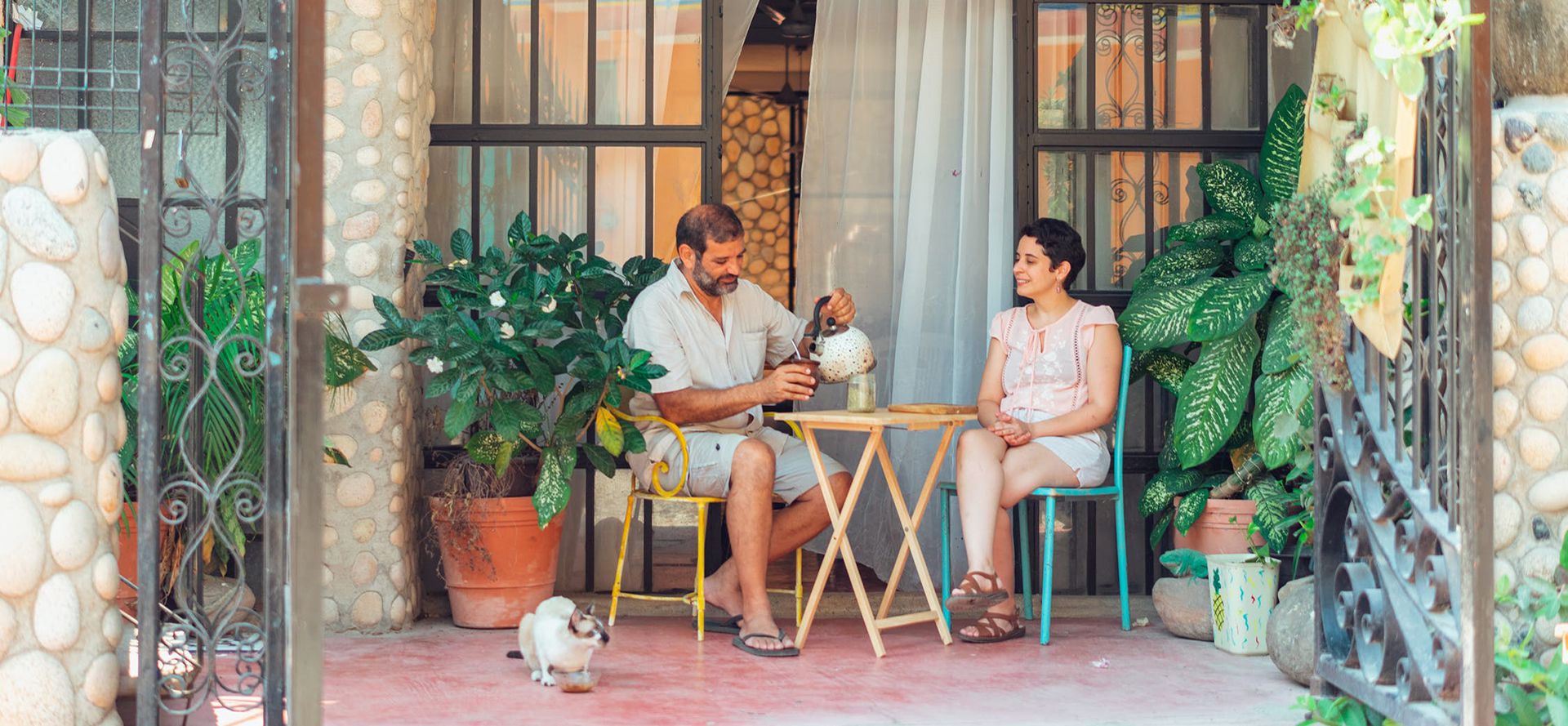 Couple on dating drinking coffee in the garden.