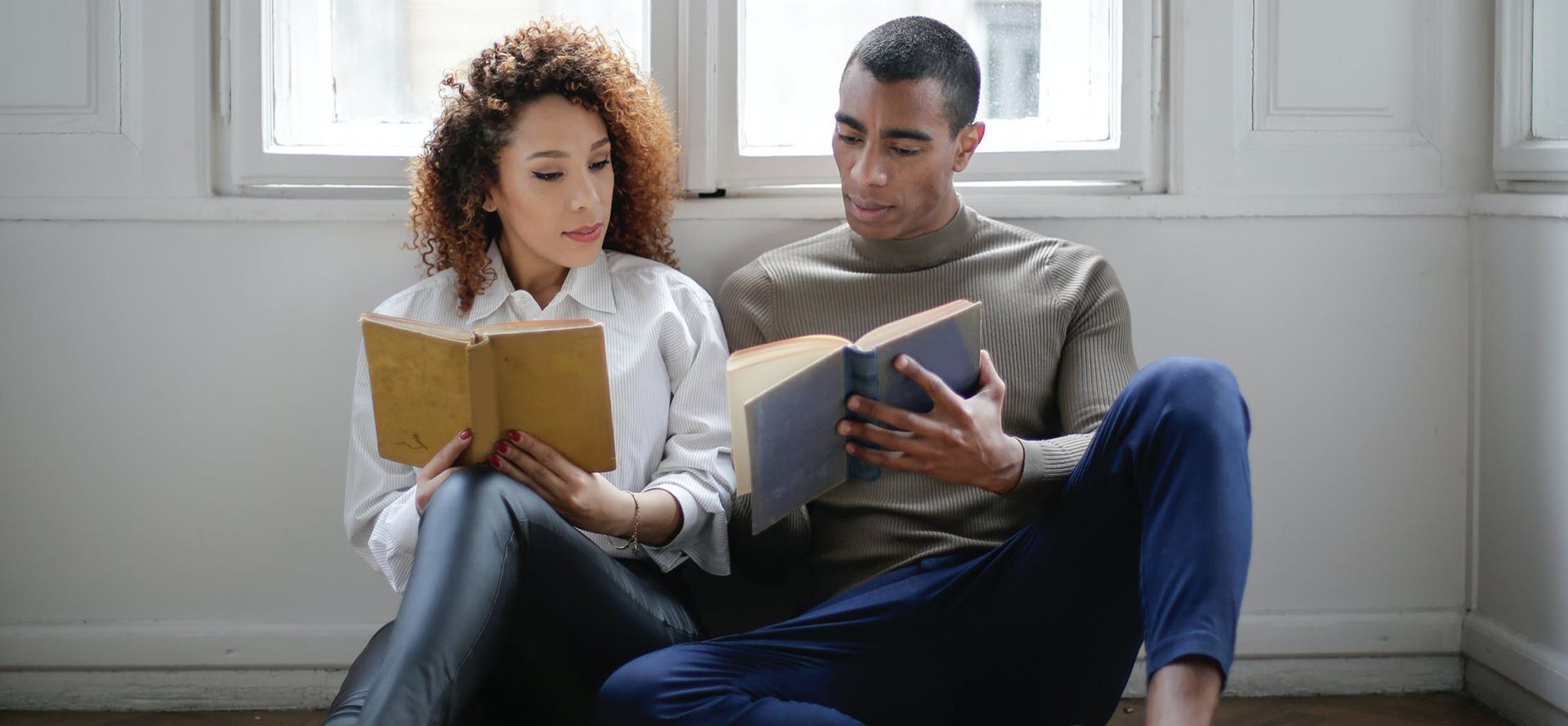 Couple on dating reading books.