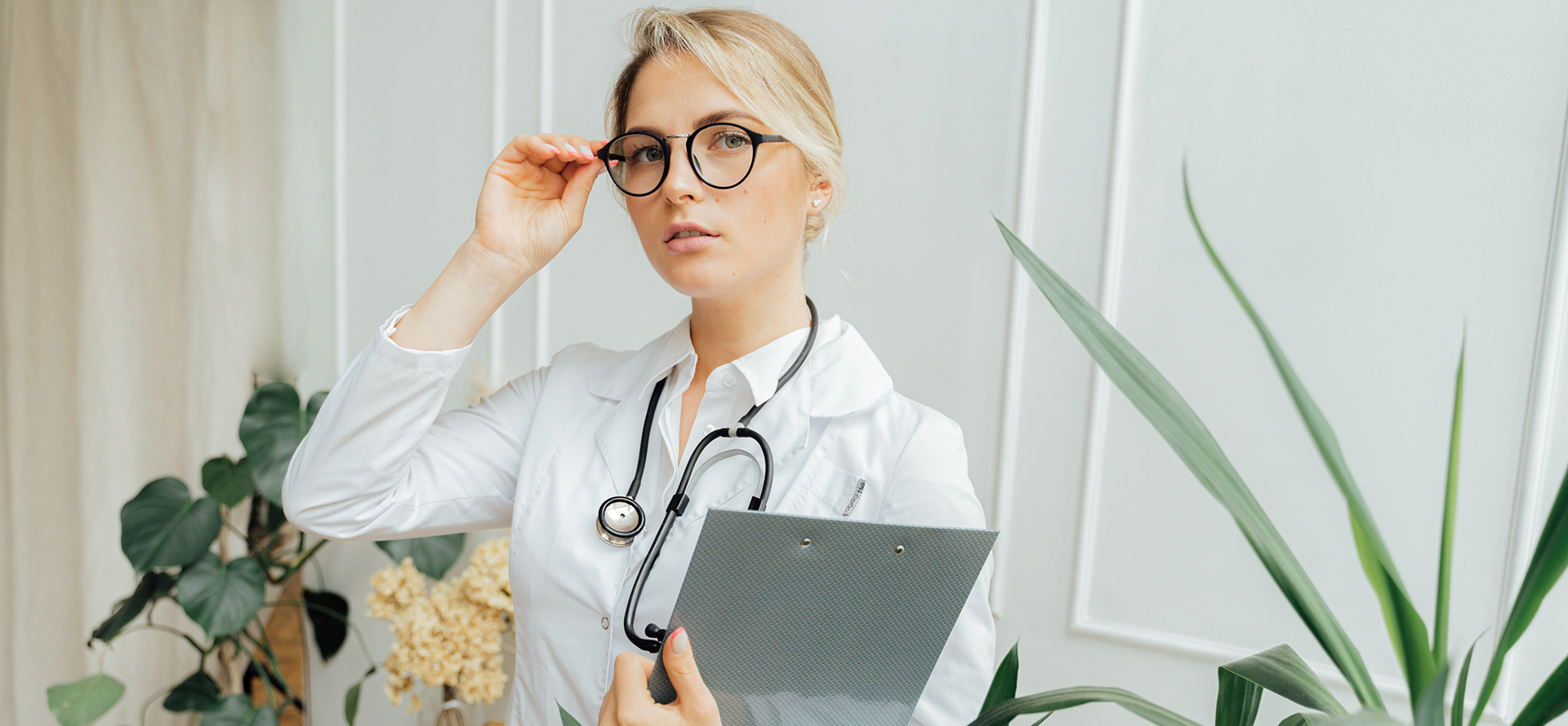 Single female doctor in black glasses.