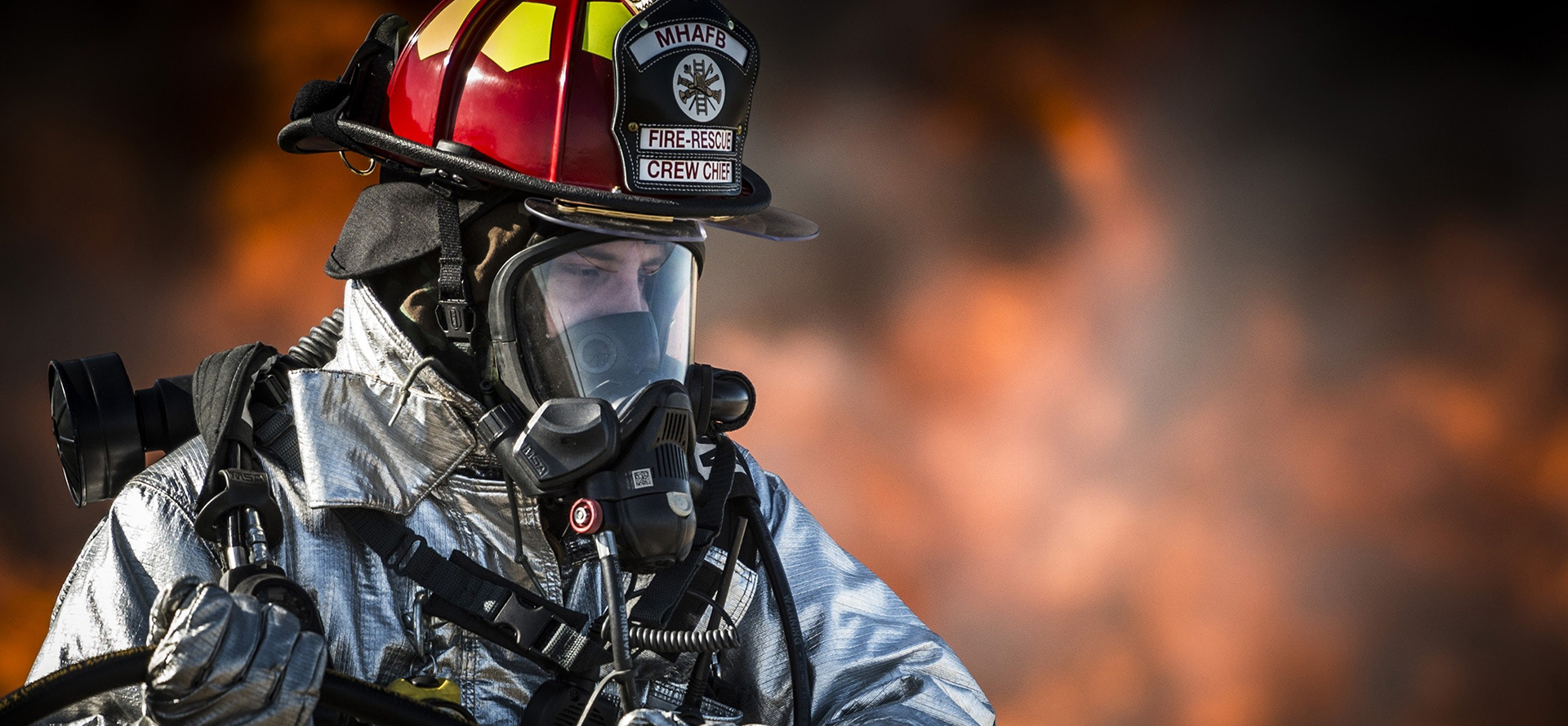 Firefighter in the background of the fire.