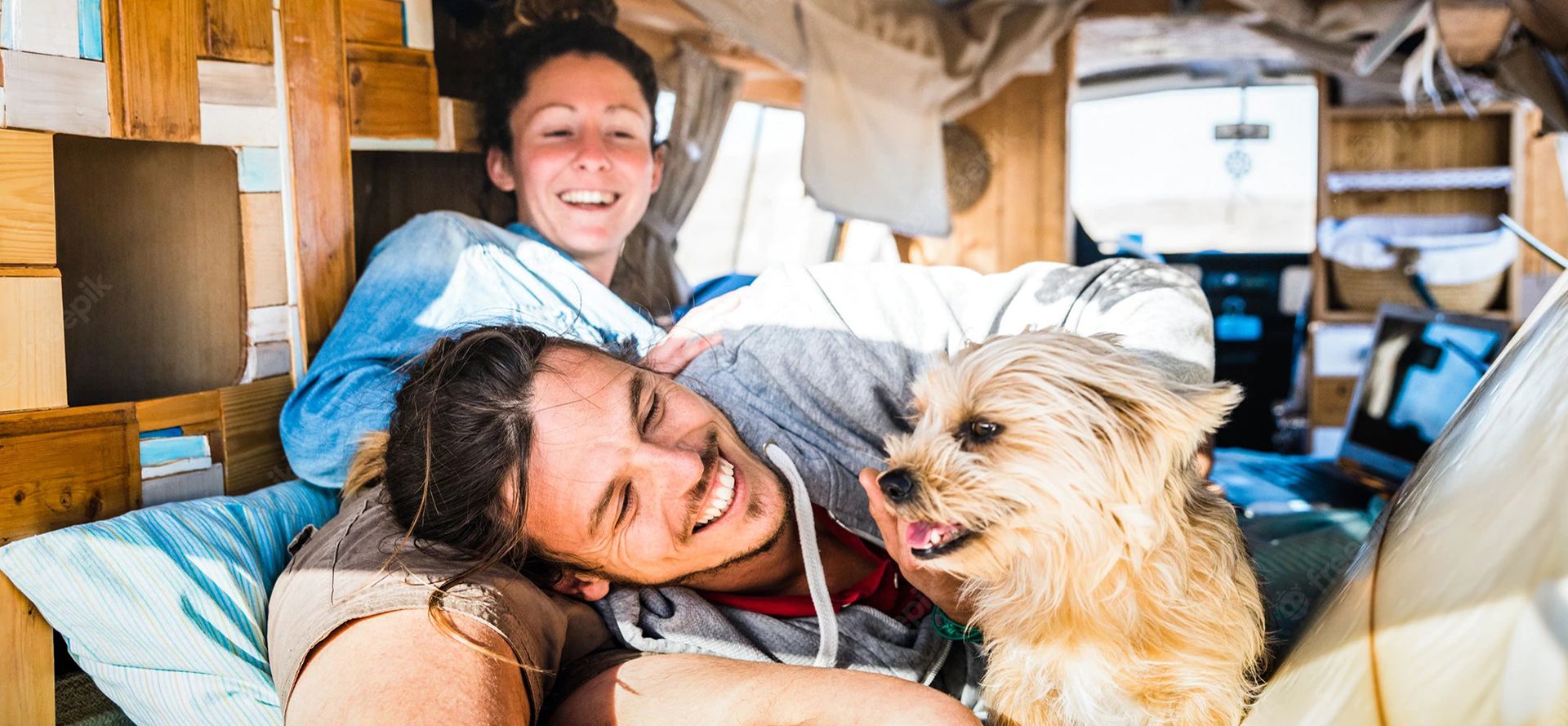 Hippie dating in a bus with a dog.