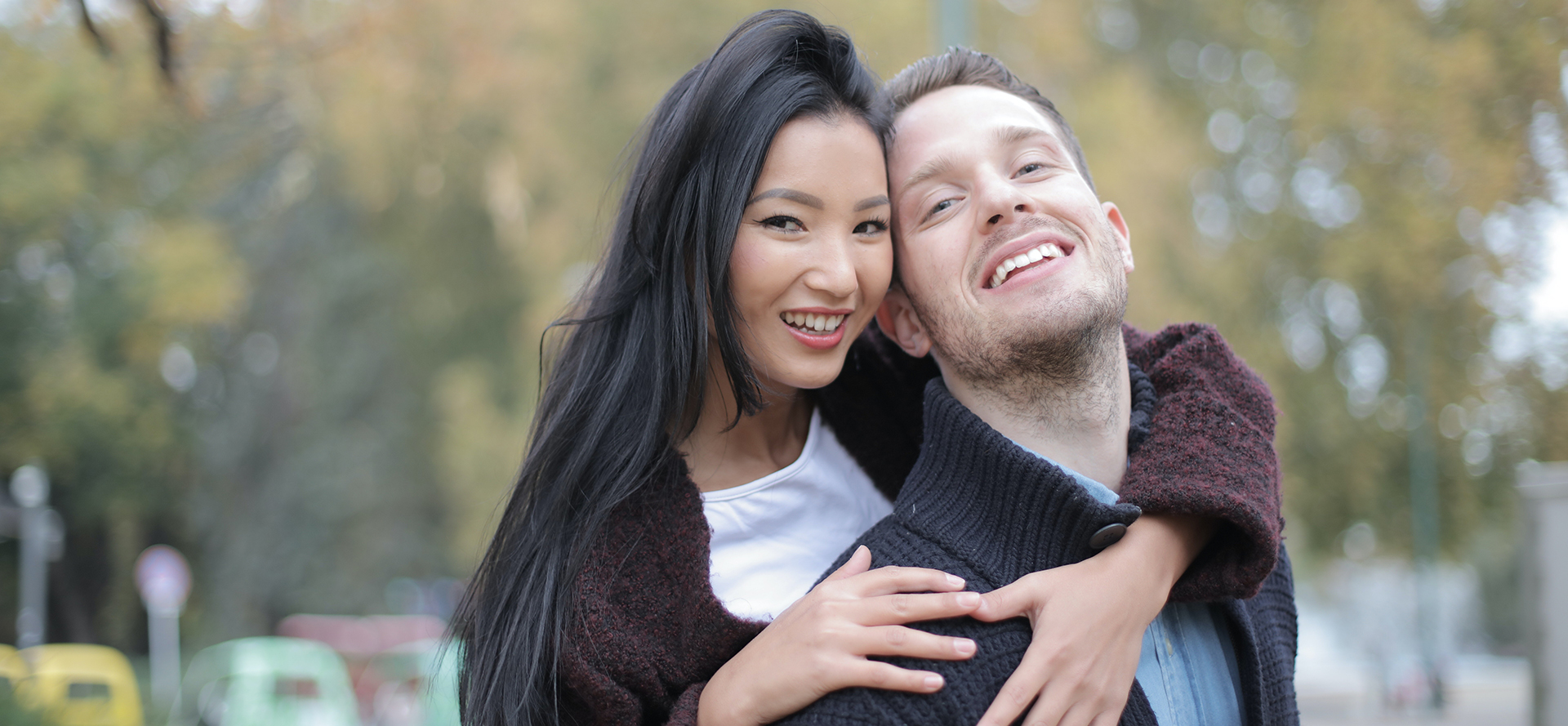 Interracial couple smiling.