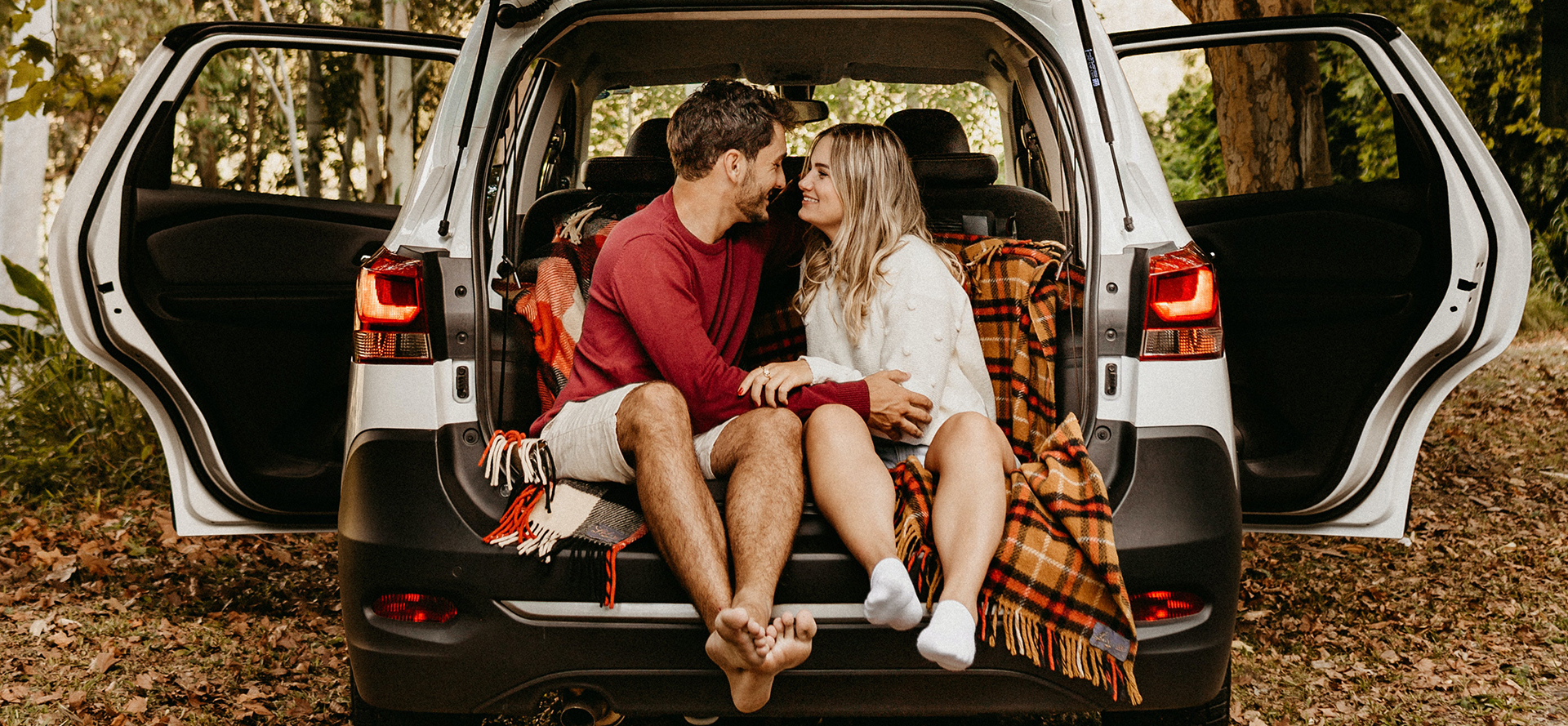 A couple on a date is sitting in the car.