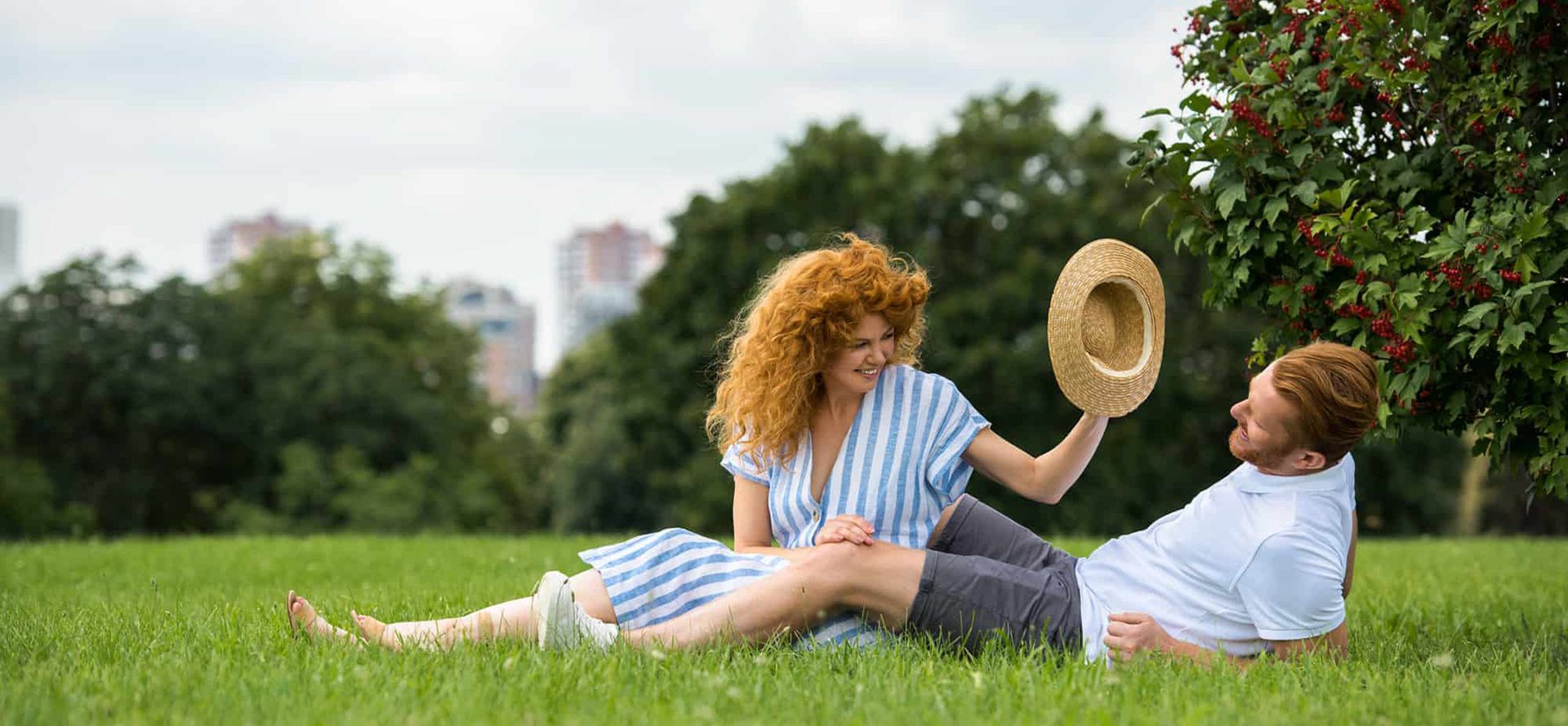 Redhead couple on date in the field.