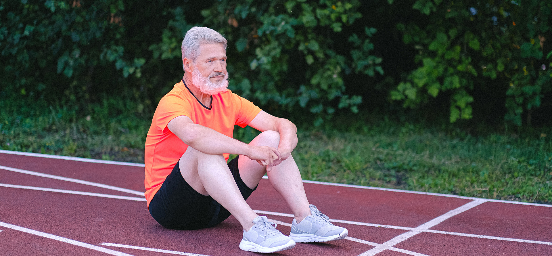 A retired military man is resting after a run.