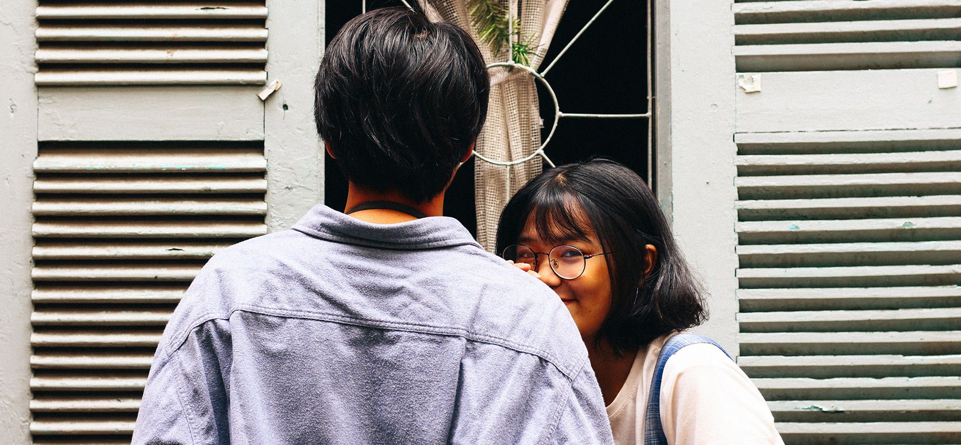 Teen girl hugging a boy on a date.