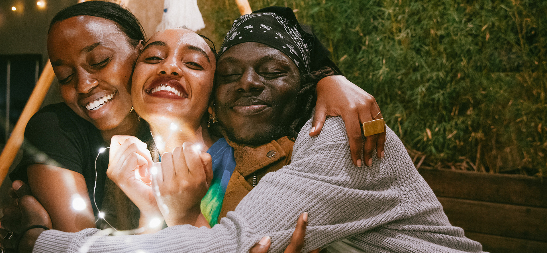 The man hugs the girls.