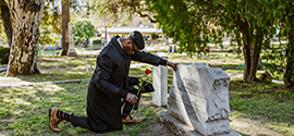 The widower came to the cemetery to honor the memory of his deceased wife.