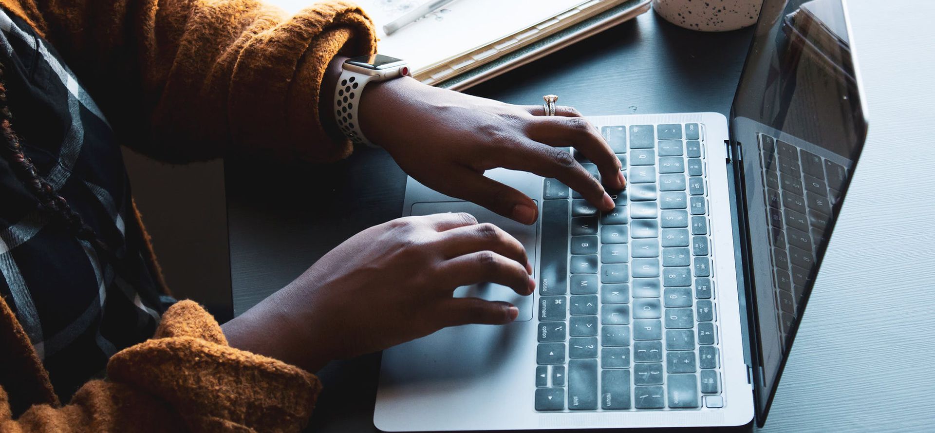 A woman writing a dating profile.