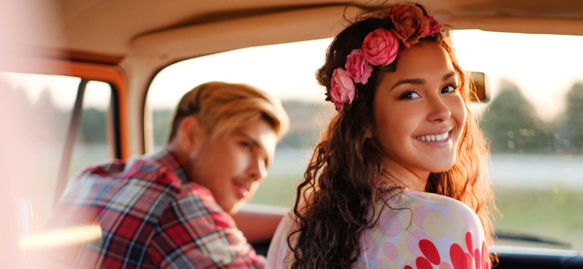 Hippie dating in a car.